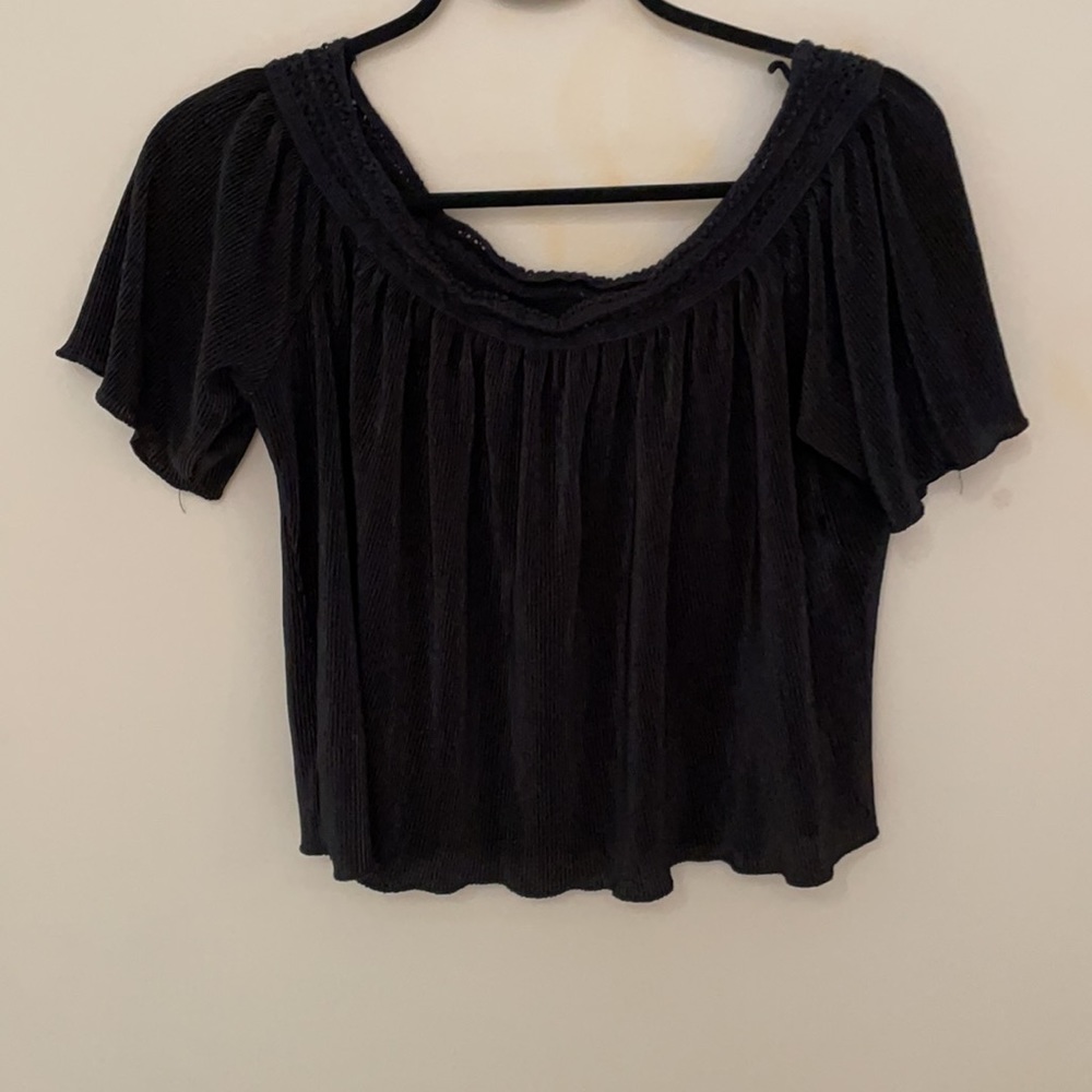 Black off the shoulder flowy short sleeve blouse.